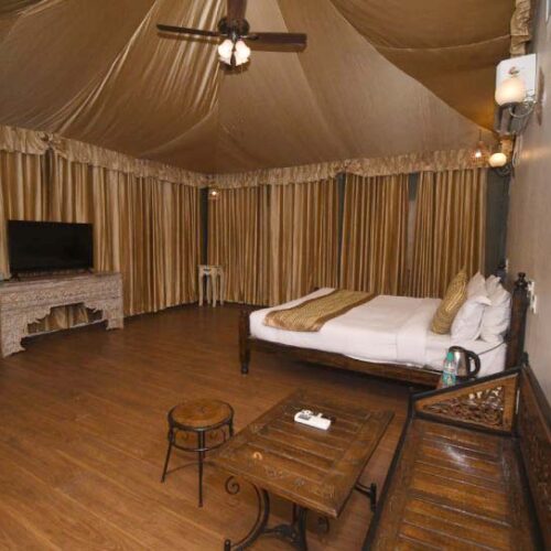 Svasara lodge exterior at golden hour Tadoba